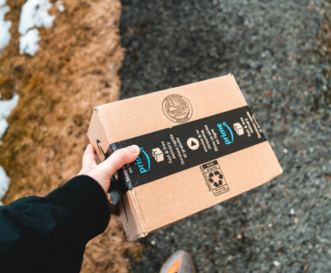 Hand holding an Amazon Prime box
